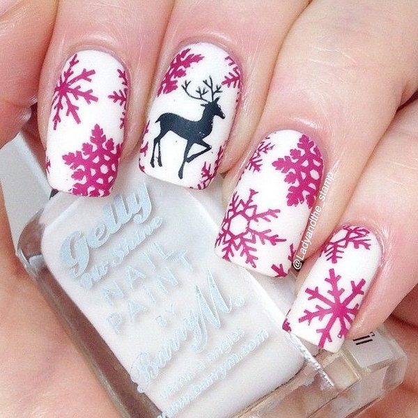 pink-snowflakes-and-black-reindeer-accent-nail-art