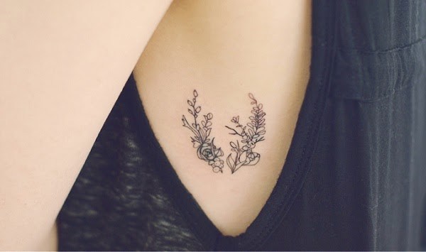 small-flower-tattoo-on-side-rib-cage