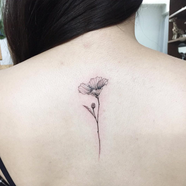 small-black-and-grey-ink-back-piece-tattoo