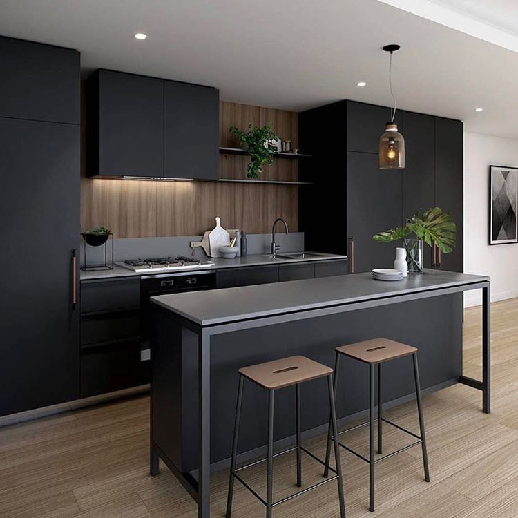 Nothing but love for this space.....and that island bench! 😍 Stunning moody and Industrial style Kitchen by FRAME Apartments