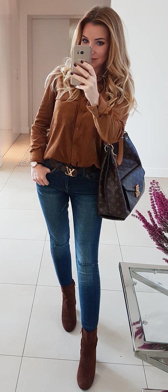 women's brown button up long sleeve shirt and blue jeans outfit