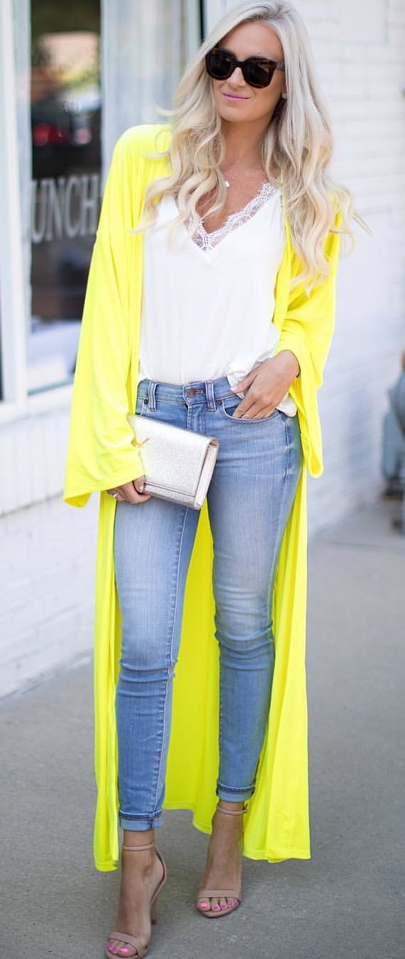 women's yellow cardigan. white plunging neckline lace floral blouse and blue denim high-waist jeans