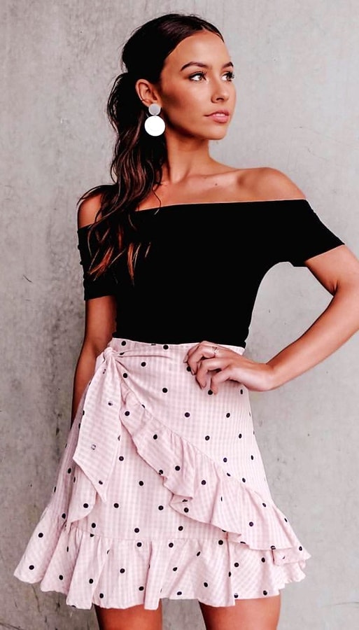 Black off-shoulder shirt with pink skirt