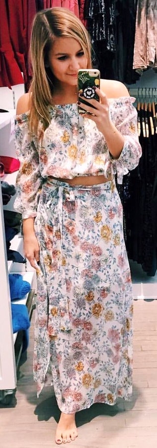 Beige, green, and yellow floral off-shoulder shirt and skirt.