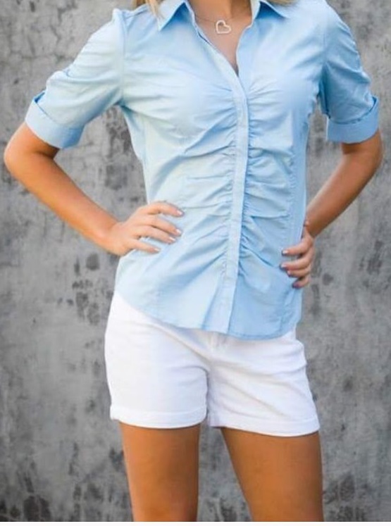 Blue Button Down Shirt With White Shorts.