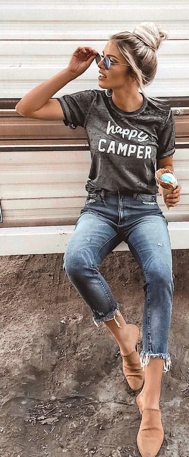 Heather-grey crew-neck t-shirt and blue-washed jeans.