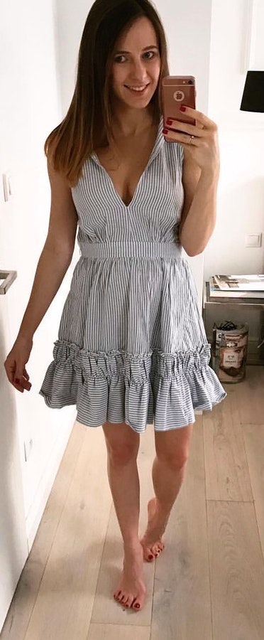 Pinstriped grey v-neck sleeveless mini dress.