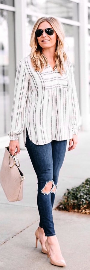 Try white and black striped long-sleeved shirt with blue denim jeans.