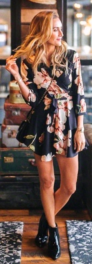 Black, orange, and green floral long-sleeved dress.