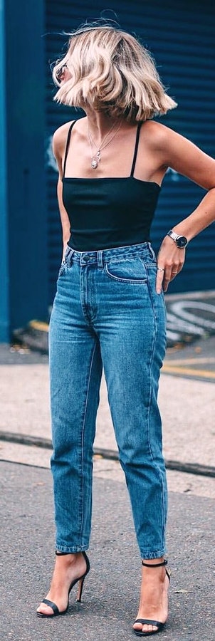 Black spaghetti-strapped tank top and blue jeans outfit.