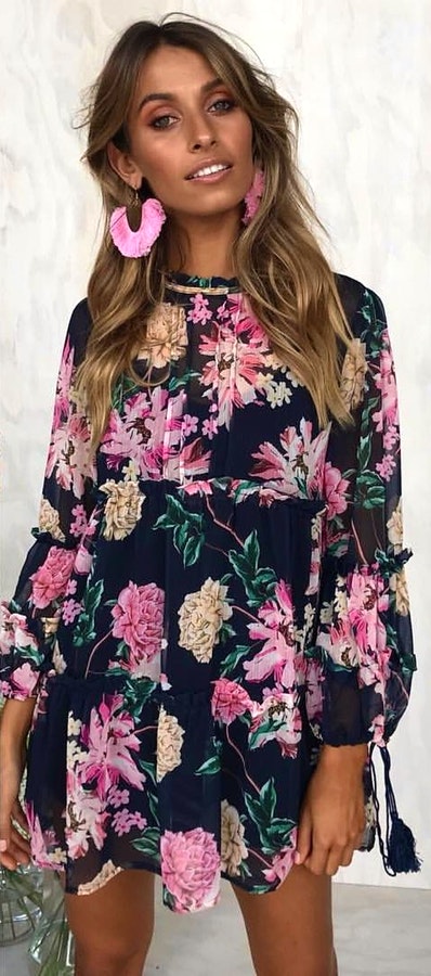 Pink, green, and black floral long-sleeved mini dress.