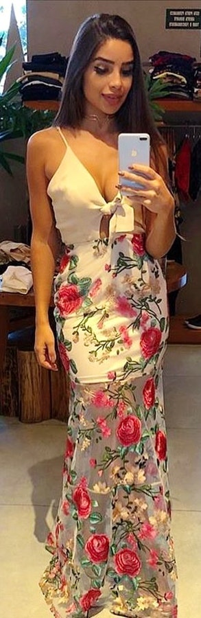 White deep v-neck sleeveless floral maxi dress.