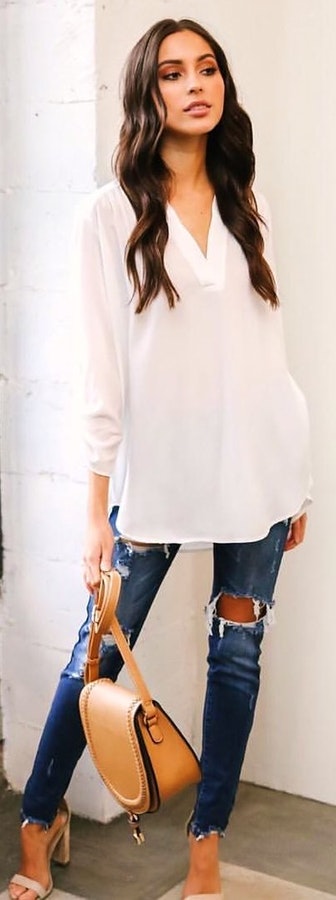 White's sheer white v-neck 3-4-sleeved top.