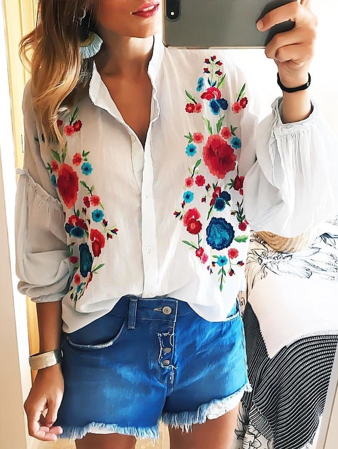 women's white floral button-up long-sleeved shirt.