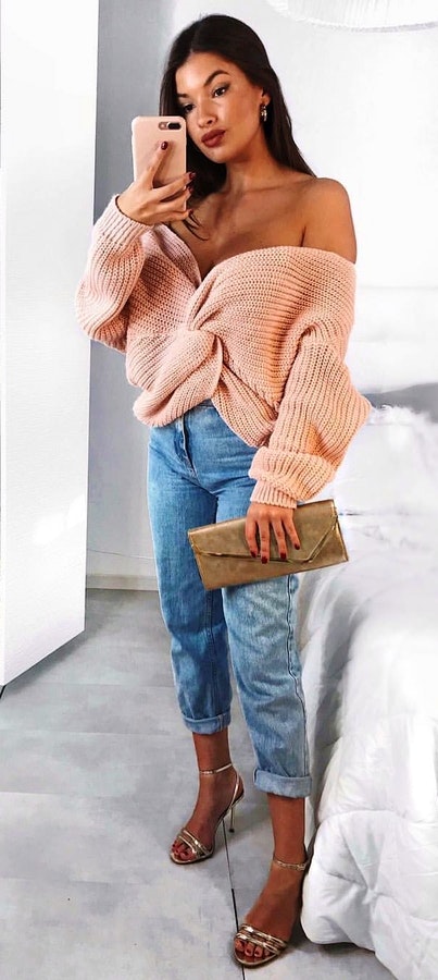 Women's beige cable knit off-shoulder sweater.