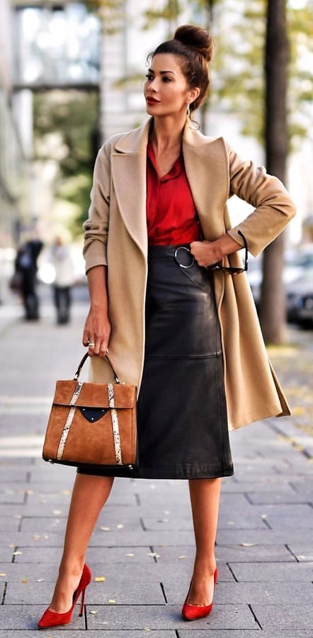 Women's brown trench coat and black skirt.