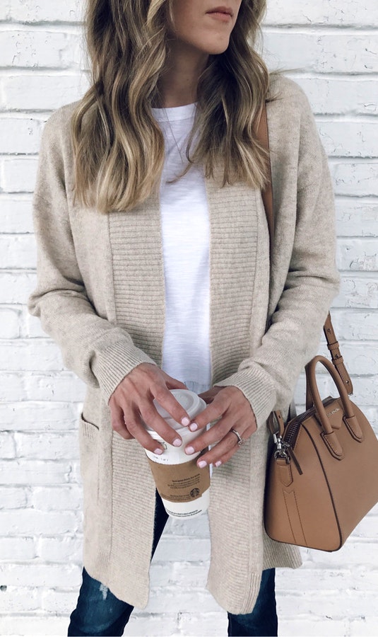 Women's gray cardigan and white inner shirt outfit.