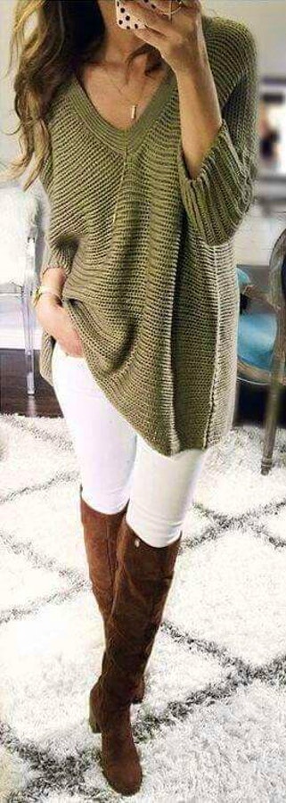 Women's gray v-neck knitted sweater, white jeans, and pair of brown suede knee-high booties outfit.