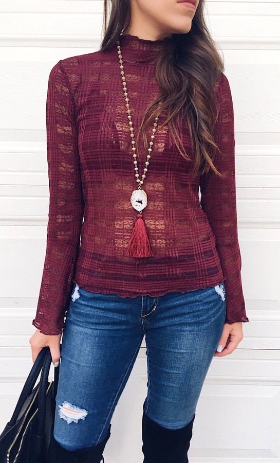 Women's maroon long sleeve shirt.