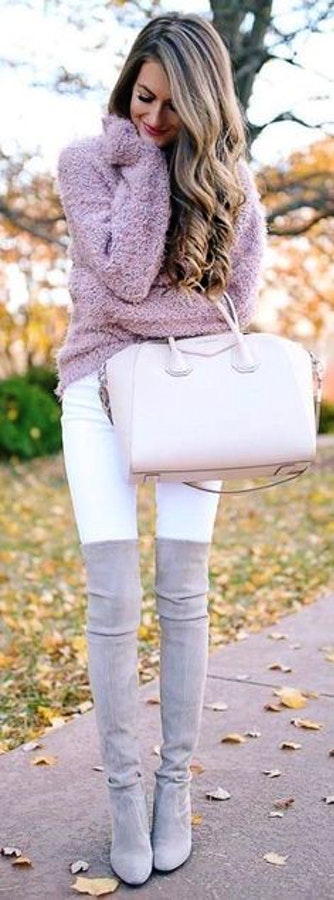 Women's pink fur coat; white jeans; pair of brown thigh-high boots.