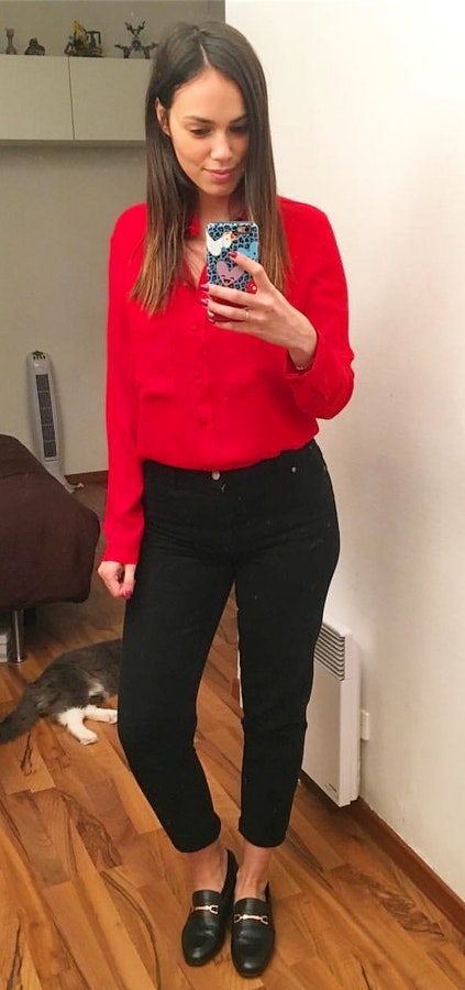 Women's red dress shirt and black pants.