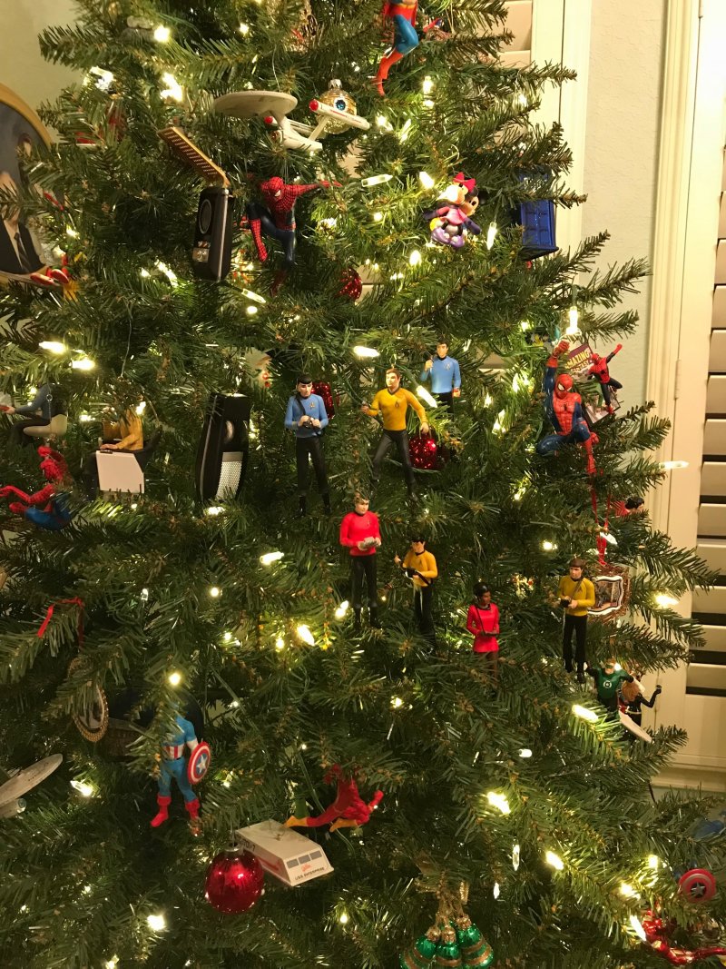 The Christmas tree serves as a gathering place and focal point of holiday decor.