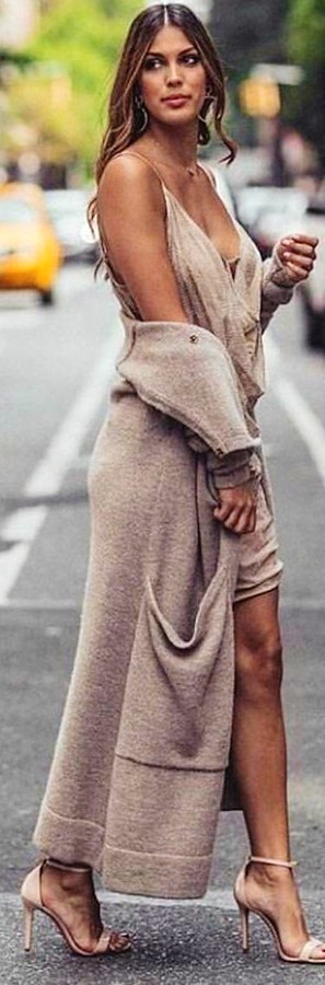 Woman wearing gray drape-neckline spaghetti strap dress.