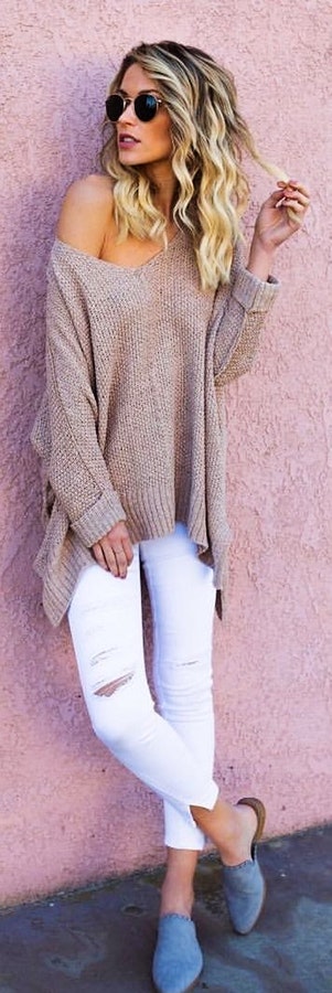 Woman wearing gray knit sweater.