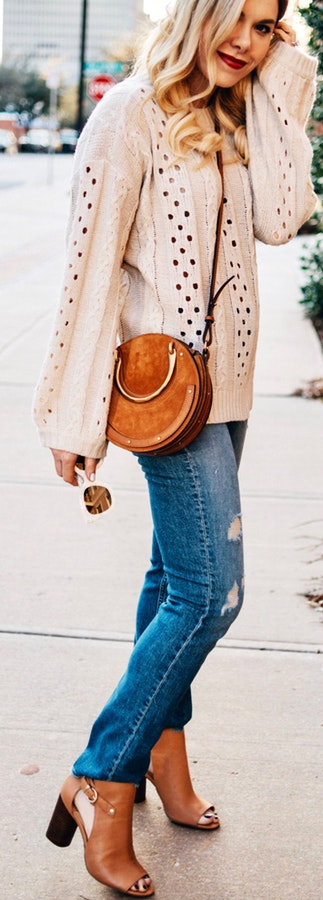 Woman in brown long-sleeved top.