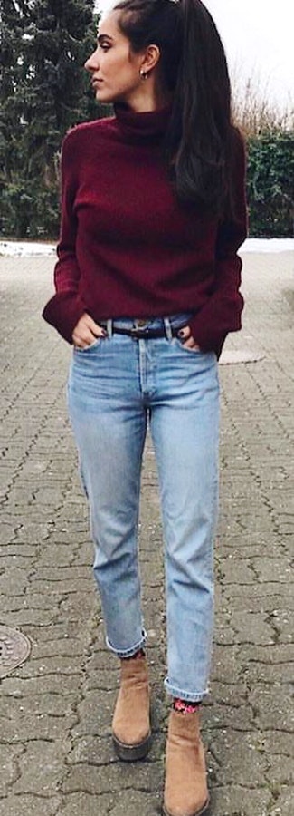 Woman in maroon long-sleeved shirt walking on concrete floor during daytime.