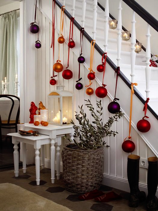 Hang large baubles from the banister base.