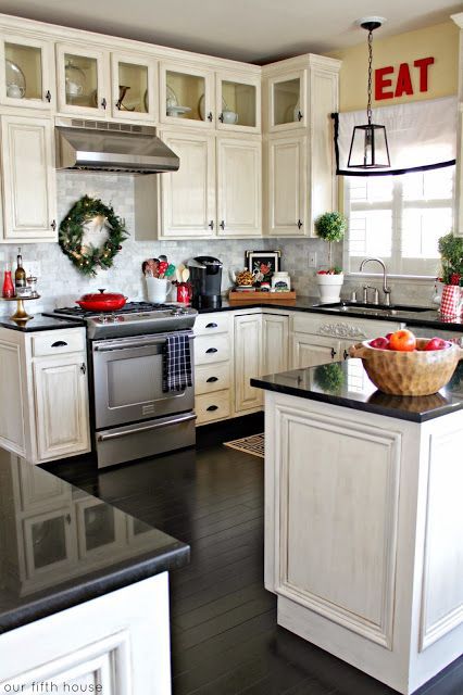 Obsessed with the small, glass paneled cabinets across the top!