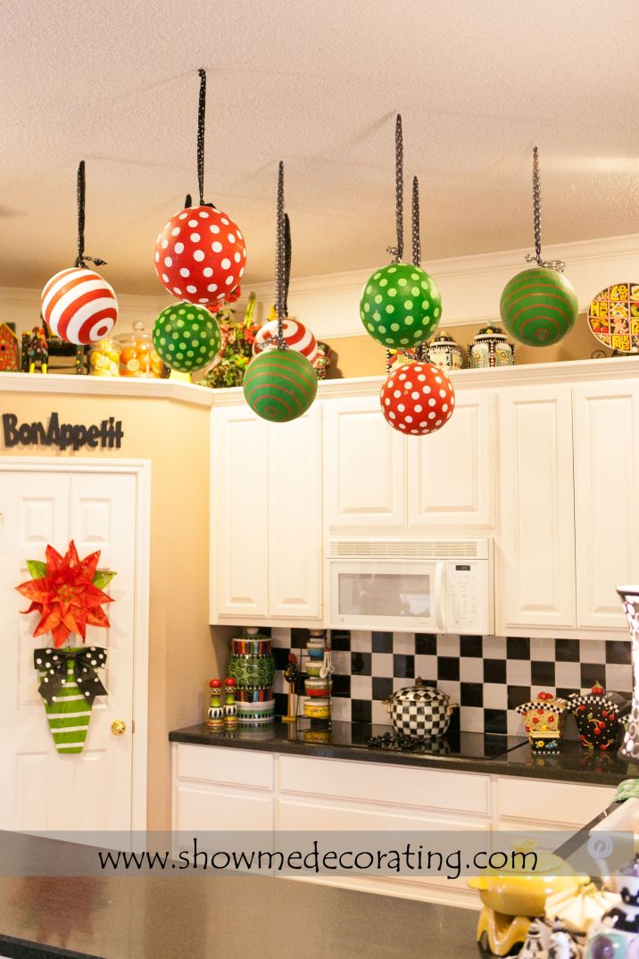 Oversized Christmas ornaments tied with coordinating ribbon.