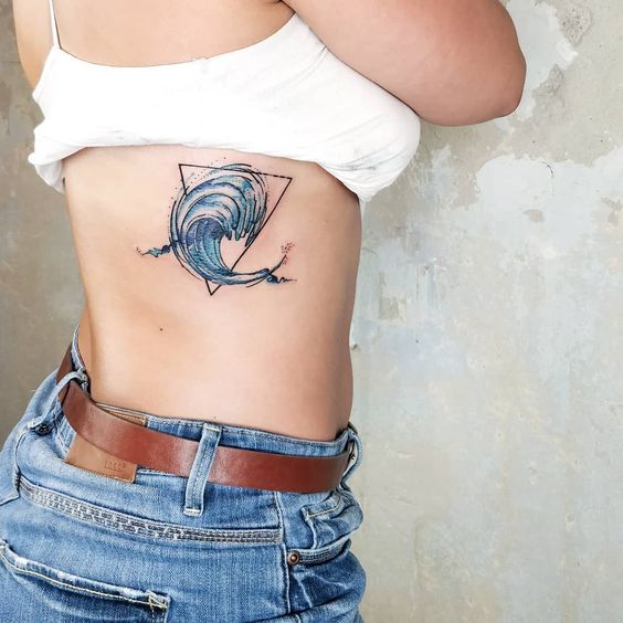 A water sign rib tattoo.