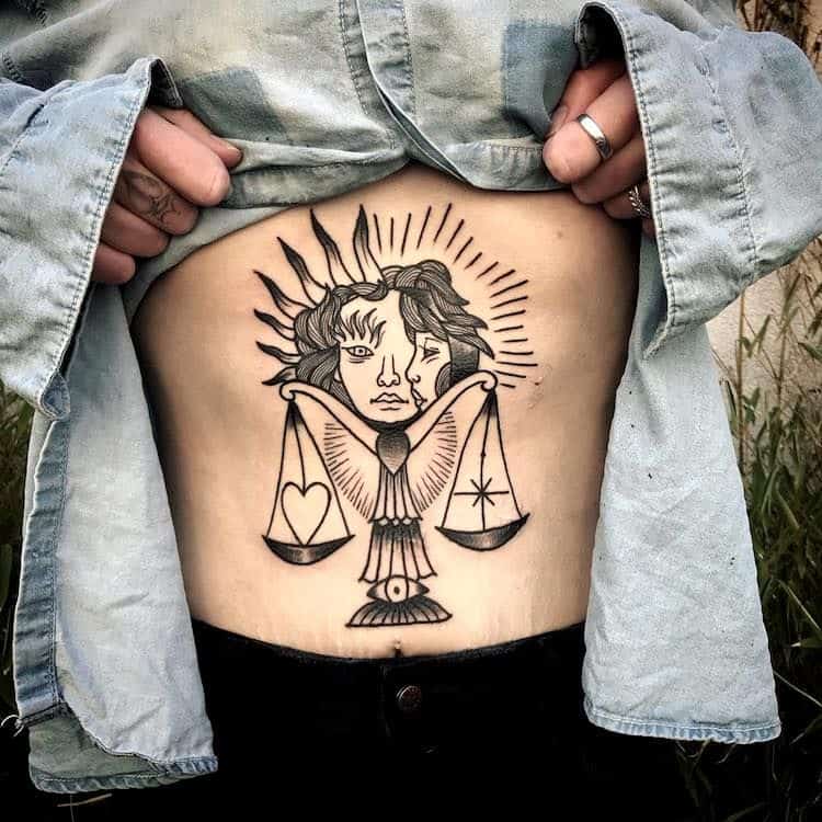 An uncommonly asymmetric Libra tattoo.