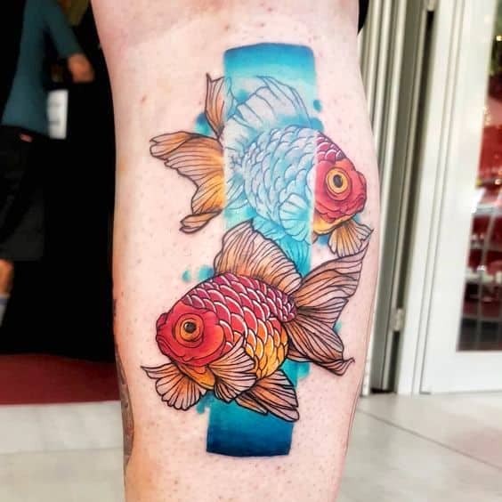 Bold fish tattoo on the leg.