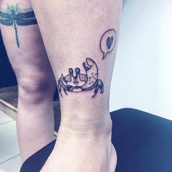 Cute dotwork crab tattoo just above the ankle.