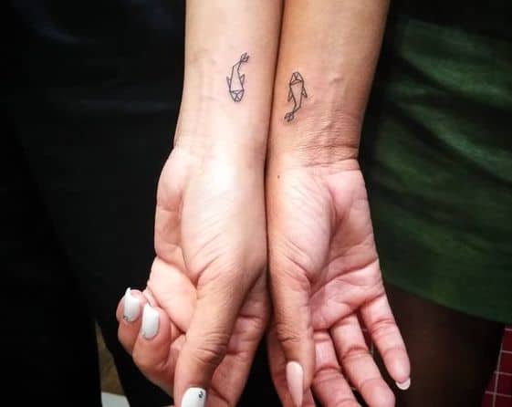 Geometric couple tattoos for Pisces.