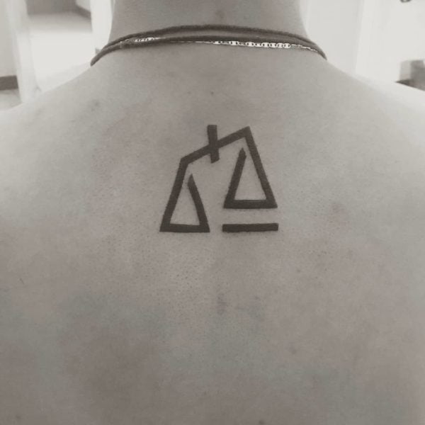 Libra Scale Abstract Blackwork Back Tattoo.