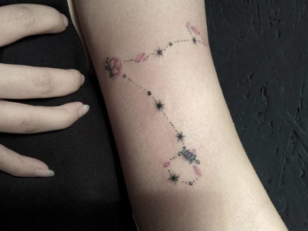 Lotus Flower Constellation Arm Tattoo.