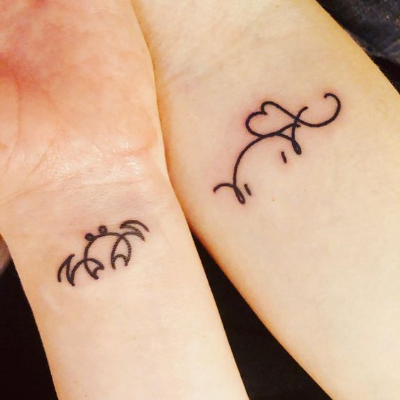 Matching fine line wrist tattoos for friends or sisters.