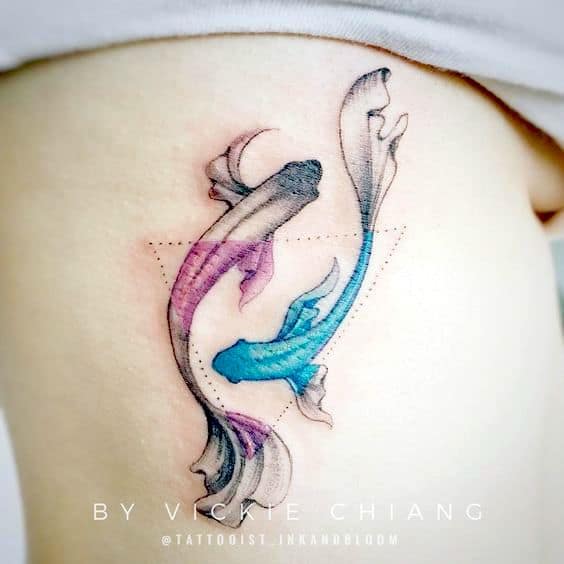 Rib triangle tattoo that plays with colors.