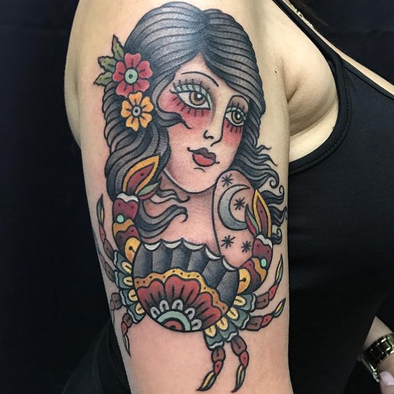 Traditional Cancer girl tattoo with stunning colors.