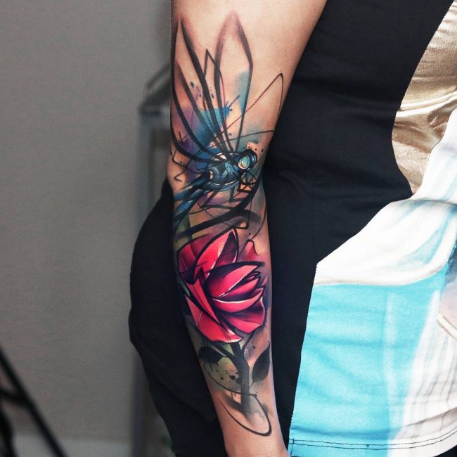 Butterflies and Dragonflies tattoo on back arm.