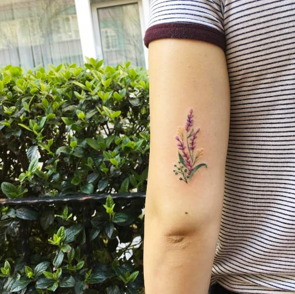 Colorful wild flowers tattoo.