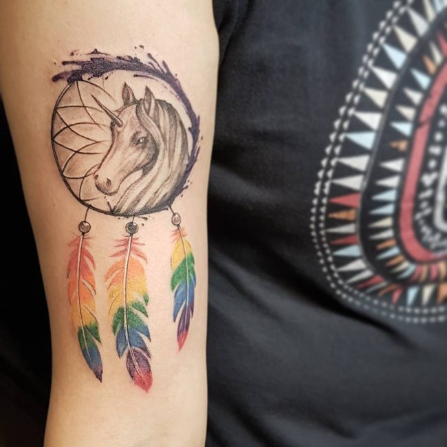 Dreamcatchers are beautiful subjects for feminine tattoos.