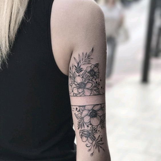 Flowers black work tattoo.