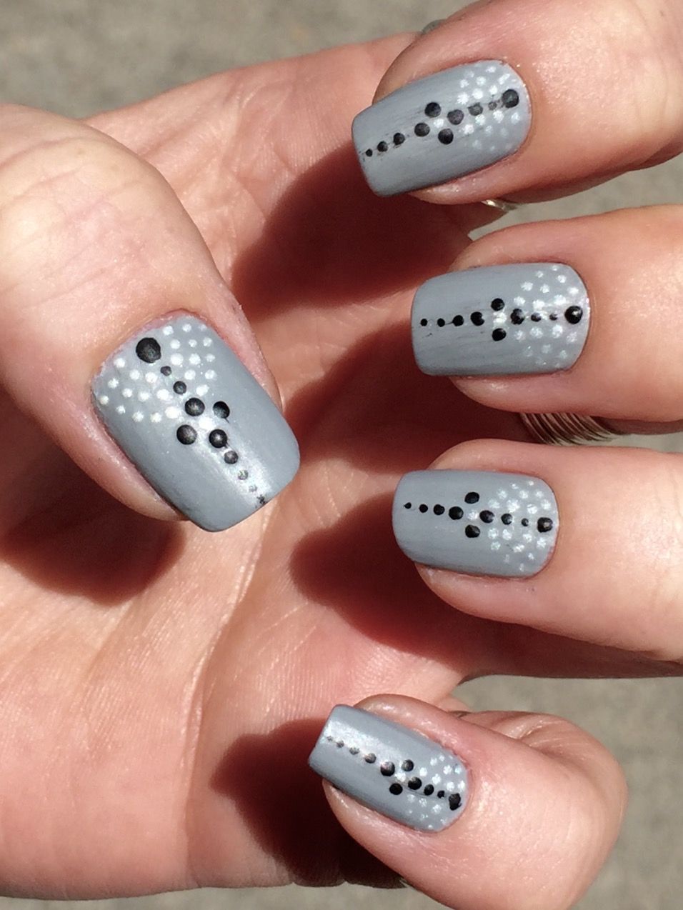 Grey white black dots