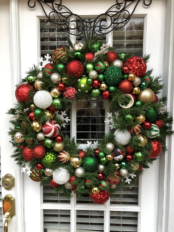 Large, lovely Christmas wreath full of beautiful ornaments.