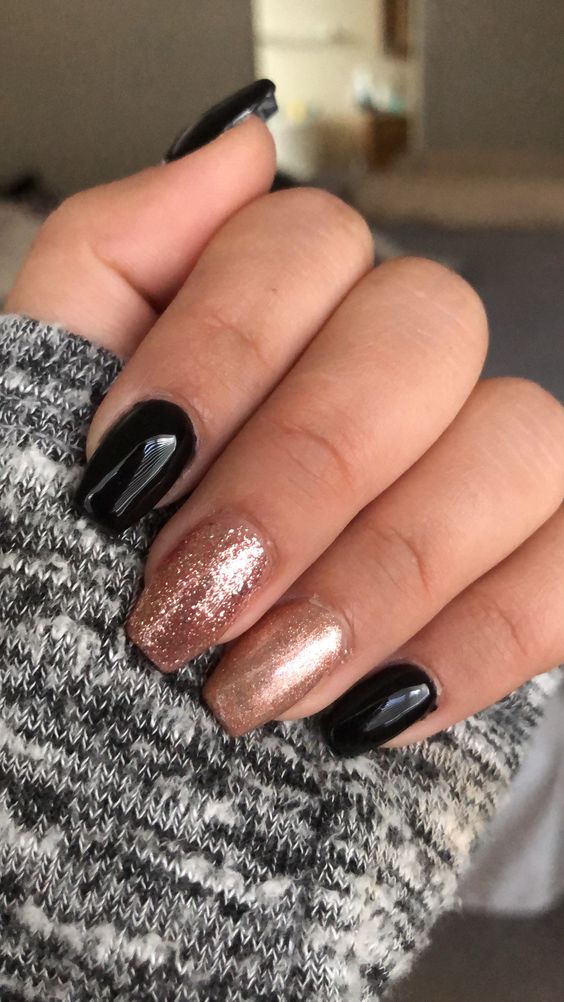 Black and rose gold glitter nails
